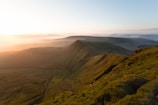 aerial view photography of mountain range under golden hour