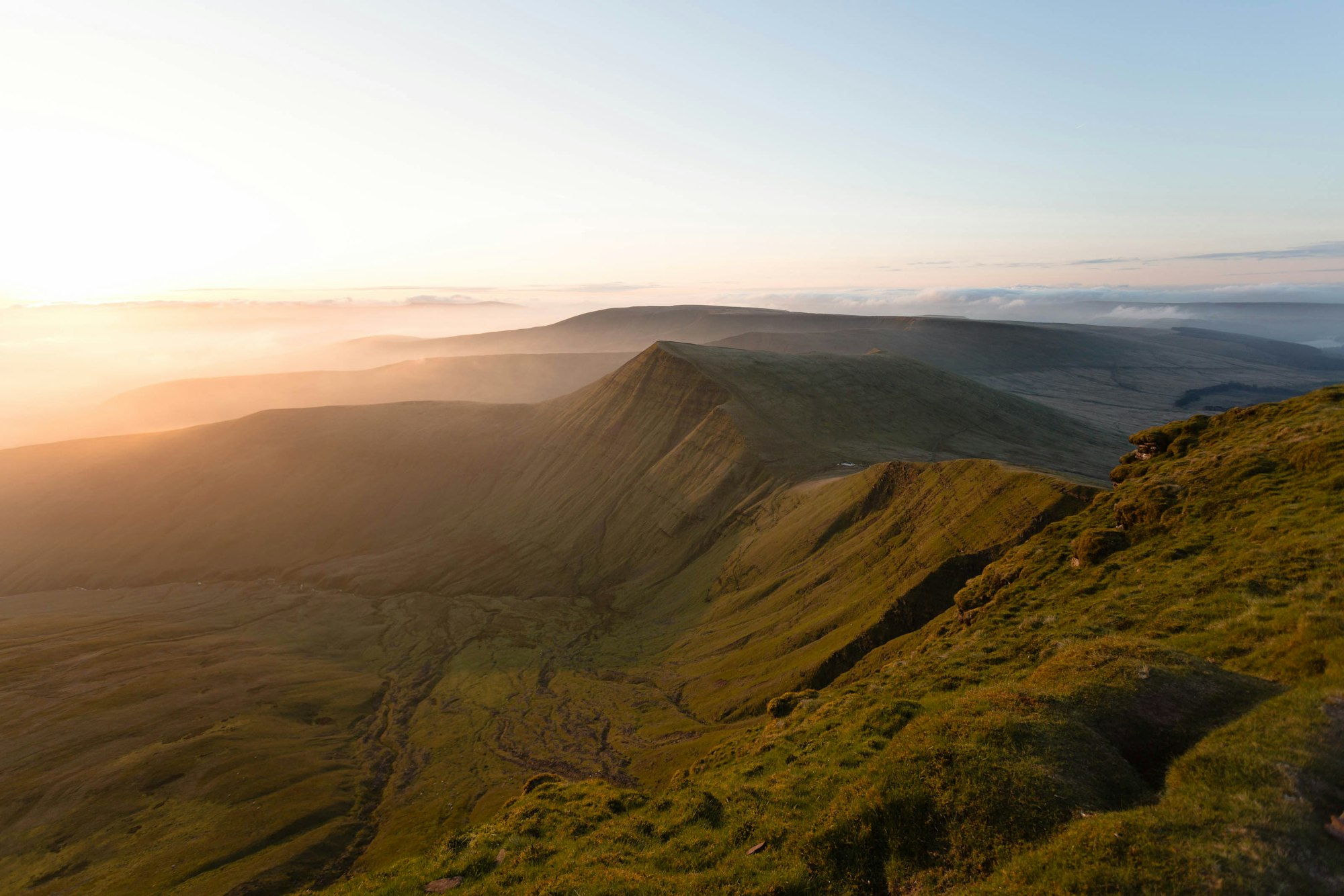 After a 3am wake up call to boil the kettle and a 4am set off on the trial, we go to the summit of Pen Y Fan just in time for the sunrise that day. And what a sunrise it was!
