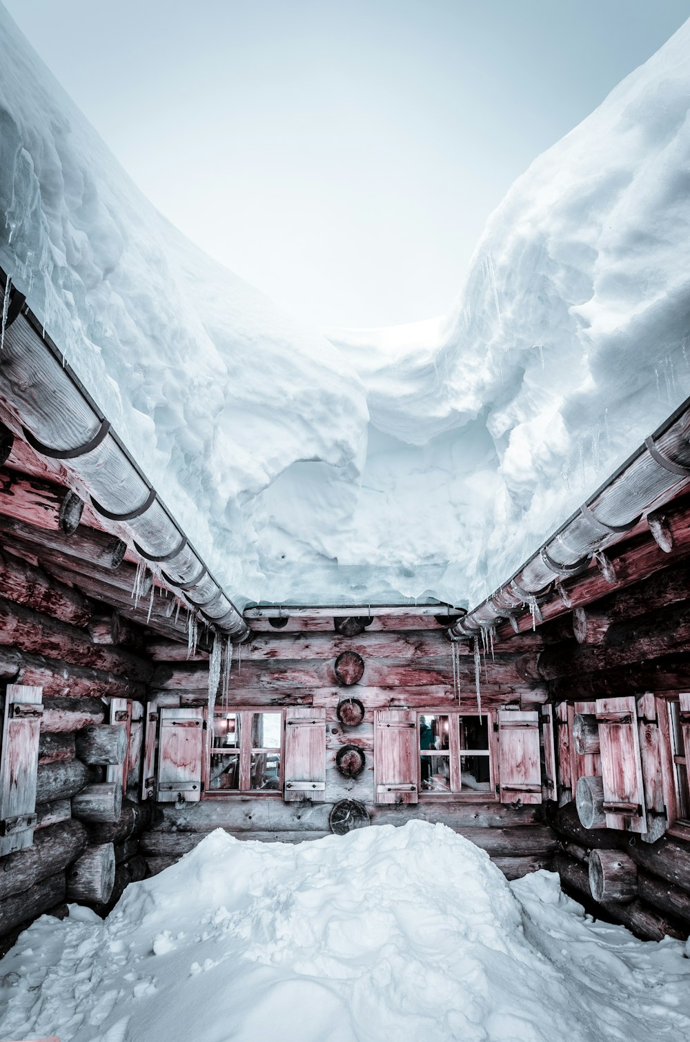 snow covered red building