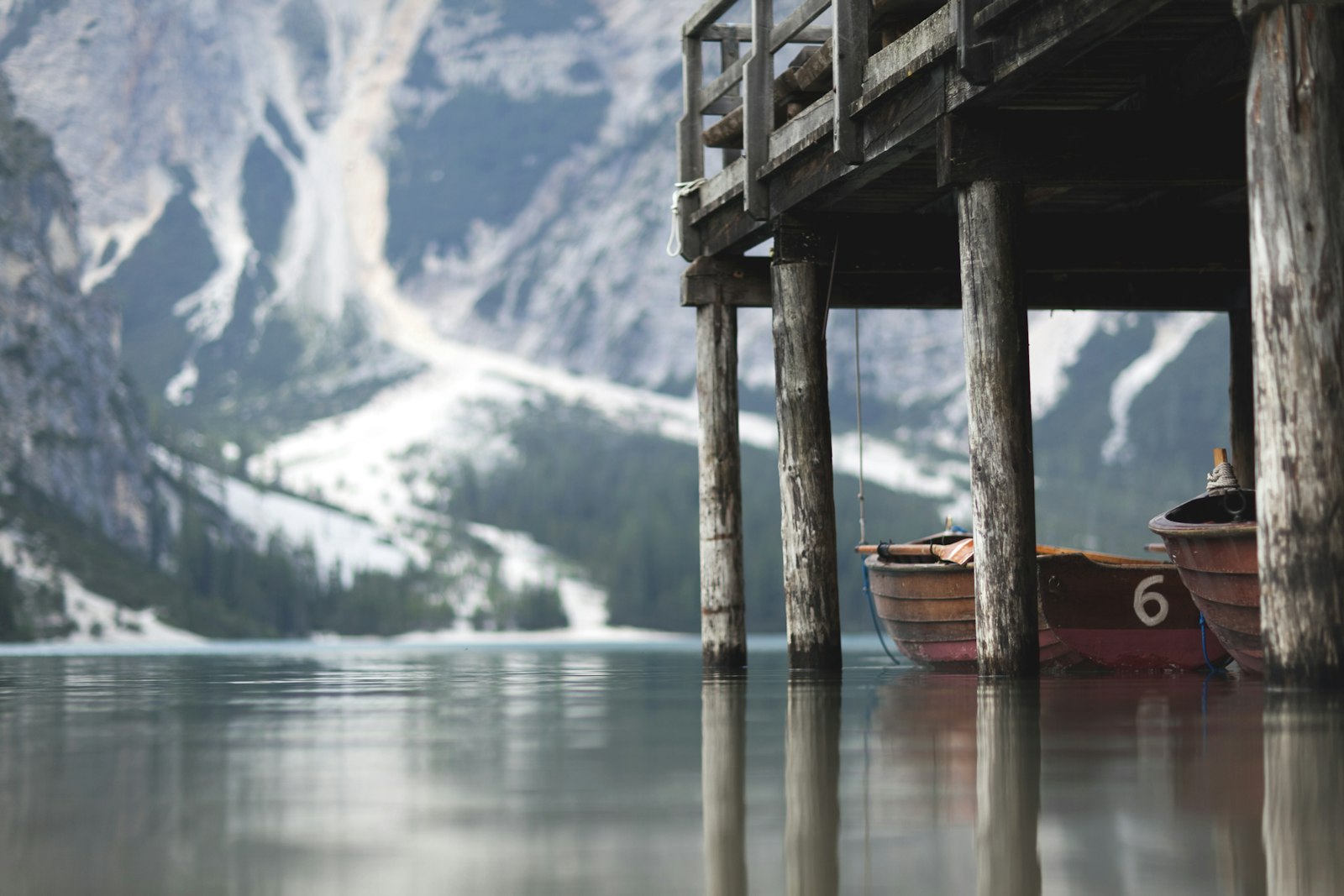 Canon EF 85mm F1.2L II USM sample photo. Two brown wooden canoe photography