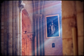 Natural light illuminating a detailed landscape painting on canvas