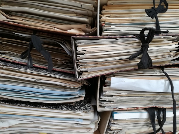 paperwork, mess, folders, chaos, overwhelmed, piles, bulging cupboards, dusty, clutter, study, house