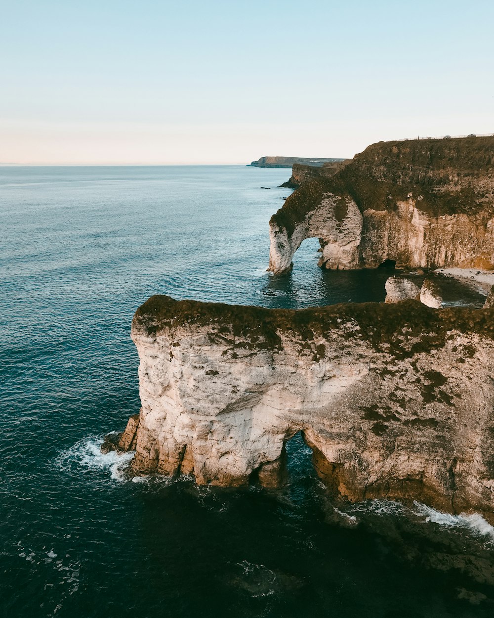 rock formation with body of water