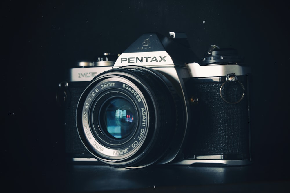 gray and black Pentax SLR camera