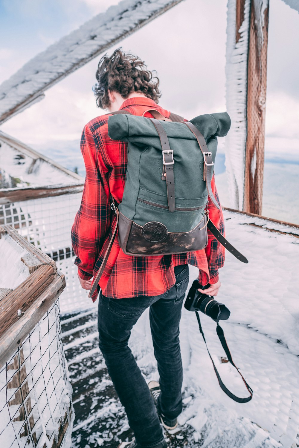 man holding DSLR camera