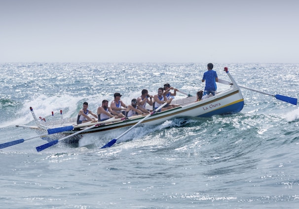 group of men riding boat