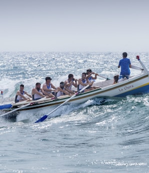 group of men riding boat