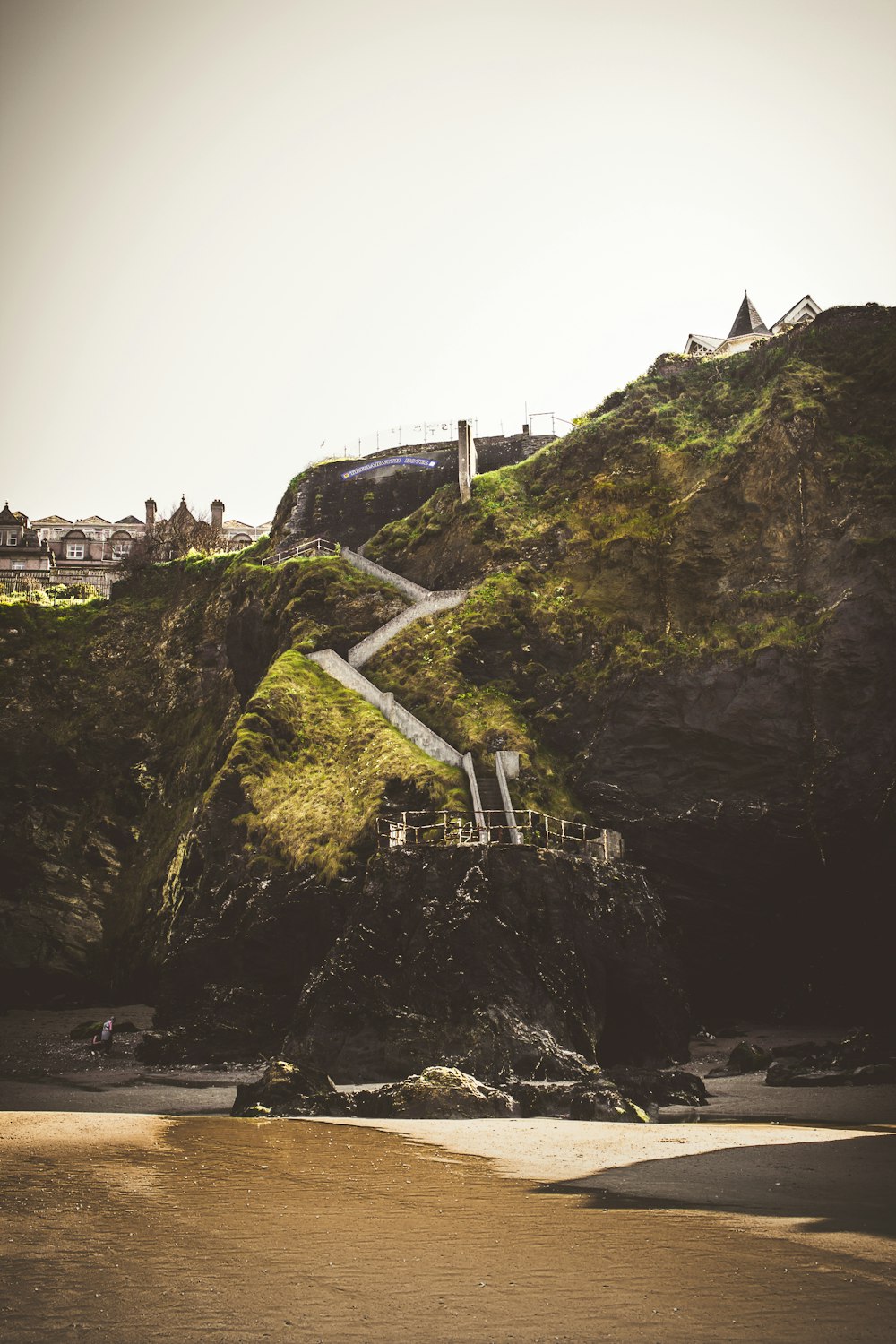 black rock formation beside sea