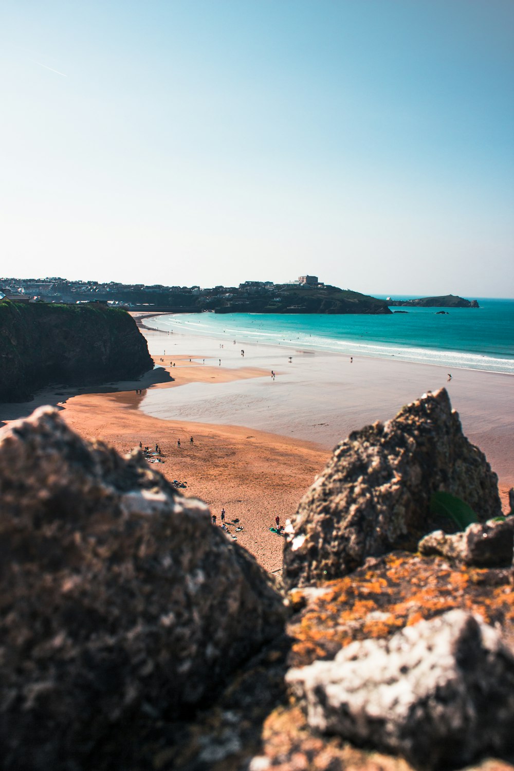 beach beside rock formation