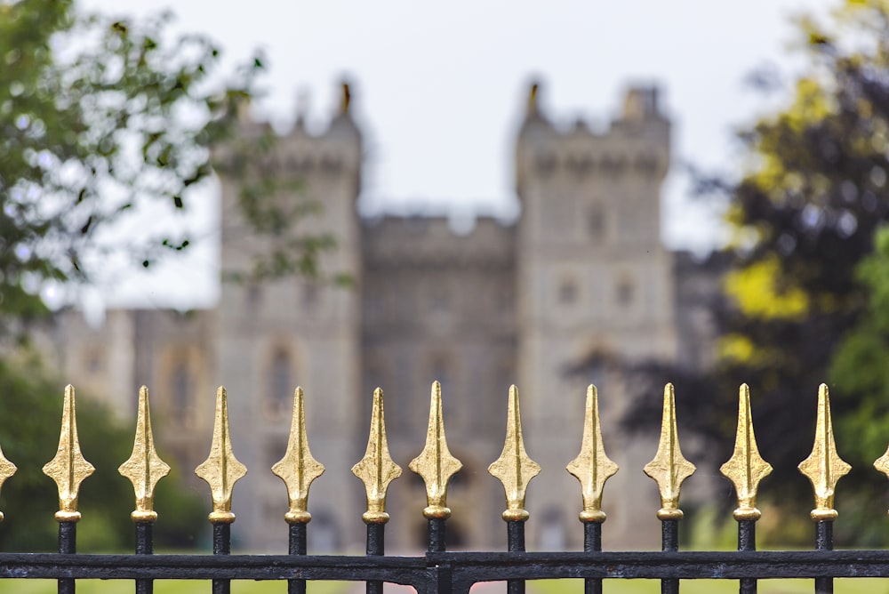 black metal fence in front of mansion