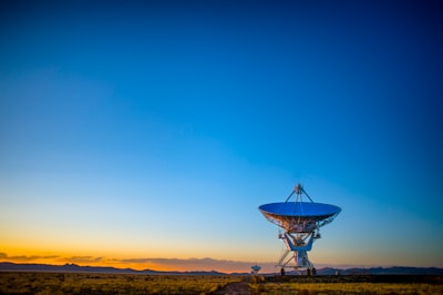 gray satellite disc on field nasa teams background