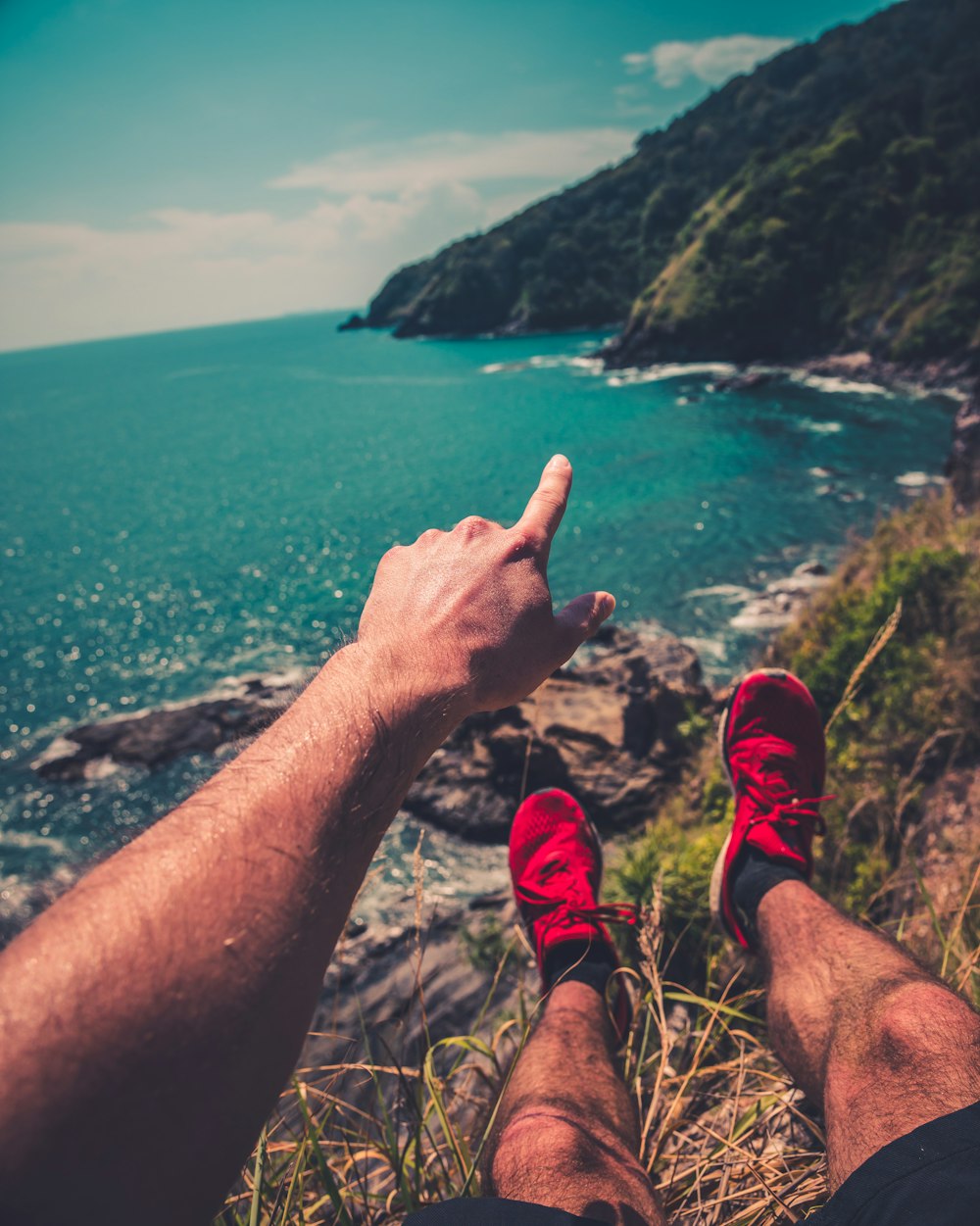 man pointing the mountain