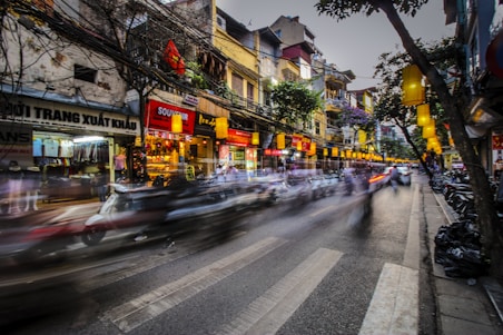 time lapse photography of vehicle towards pedestrian lane