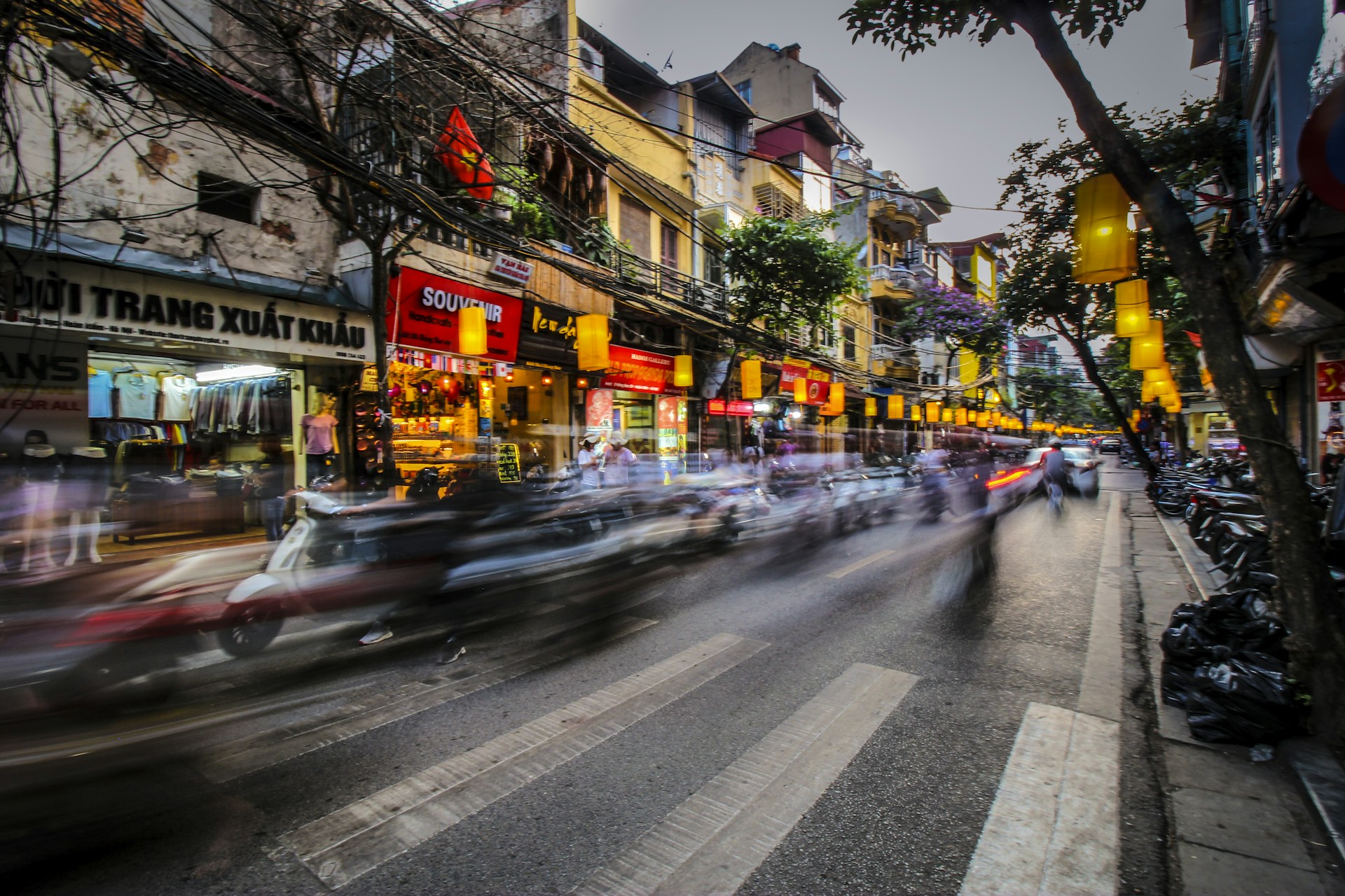 time lapse photography of vehicle towards pedestrian lane
