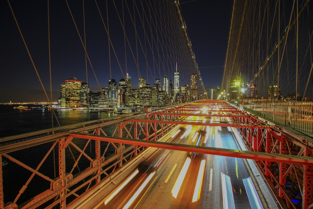 time-lapse photography of vehicles on the bridge during day