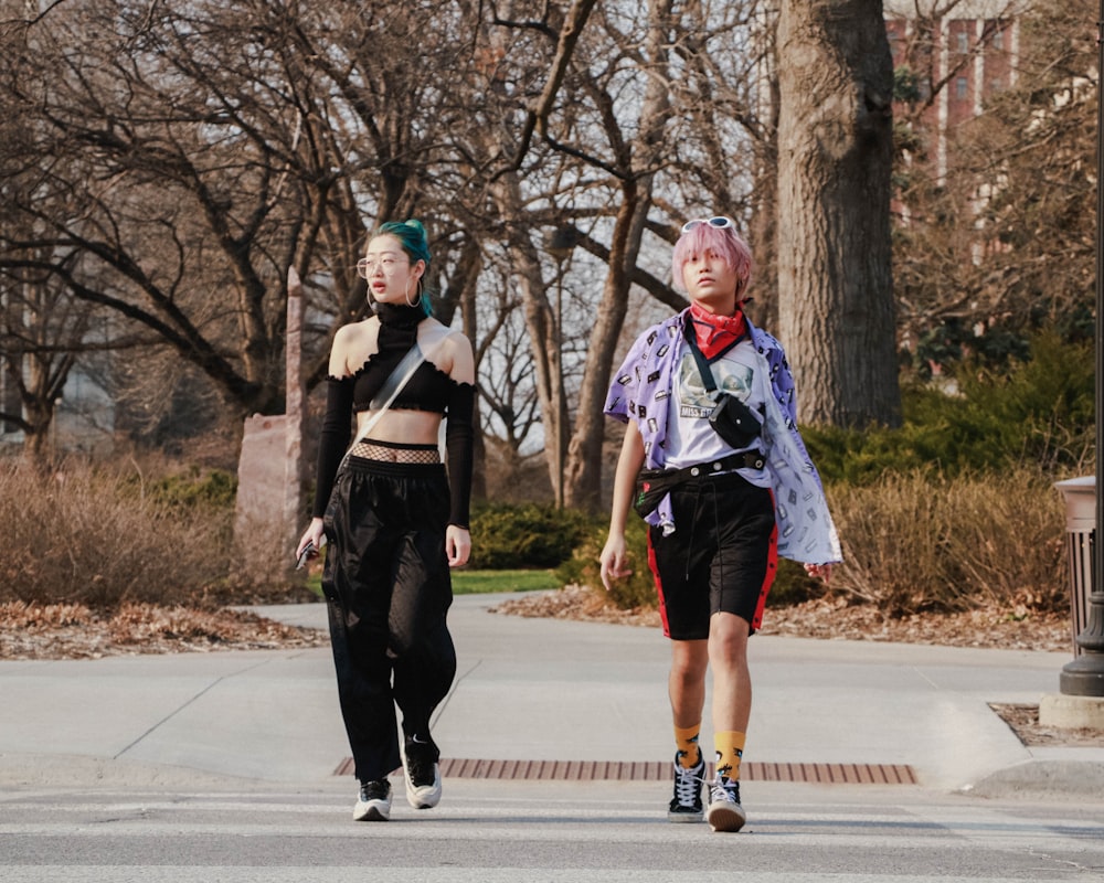 two people walking in the street