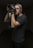 man taking photo using Canon DSLR camera