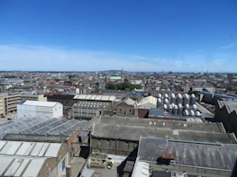 A panoramic view of Arraiján’s industrial zone under a clear blue sky with golden sunlight.