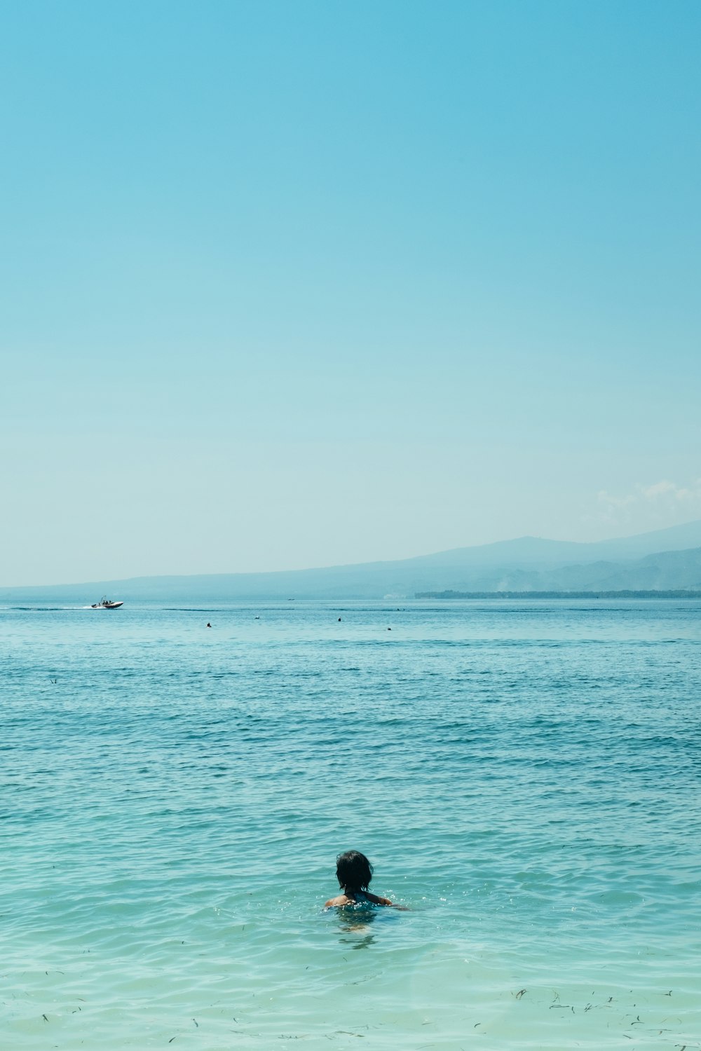 person swimming in sea