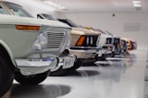 selective focus photography of assorted-color vehicles
