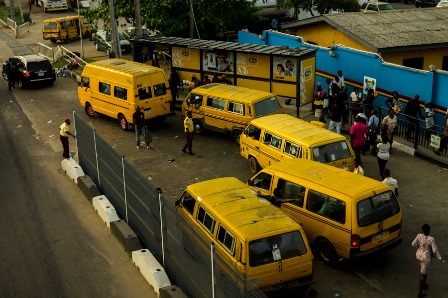 Yellow buses moving through Lagos traffic