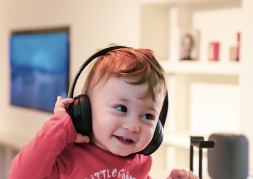 baby listening in black headset