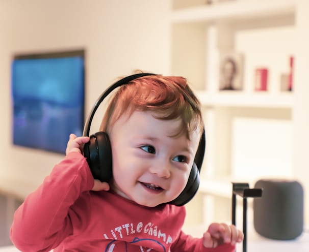 baby listening in black headset