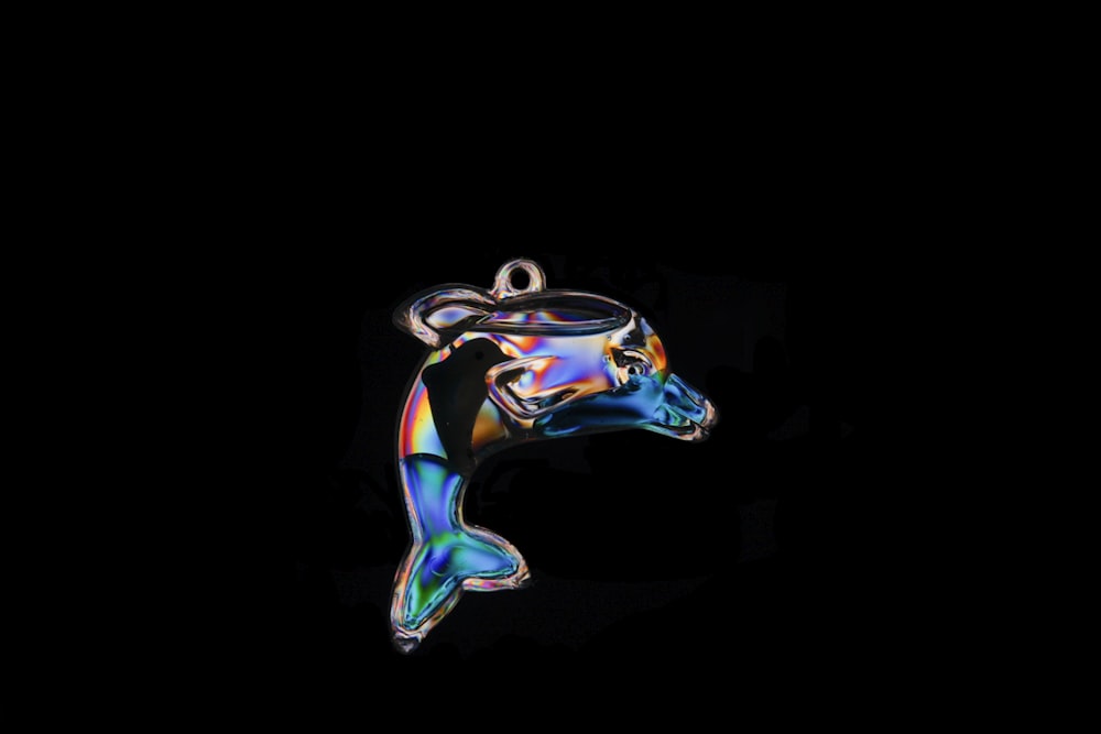 iridescent dolphin glass pendant