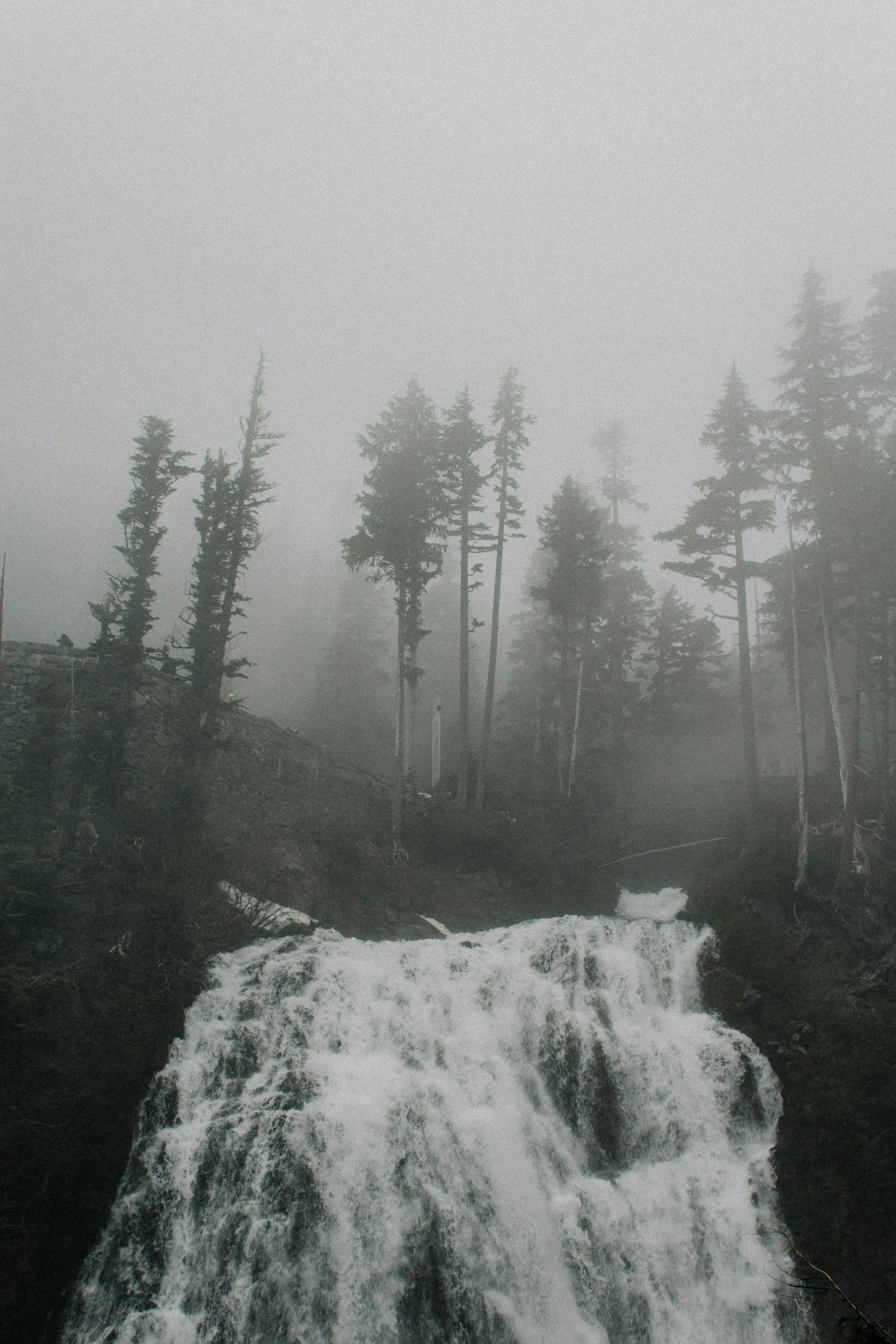 Canon EF-S 18-55mm F3.5-5.6 IS II sample photo. Grayscale photo of waterfall photography