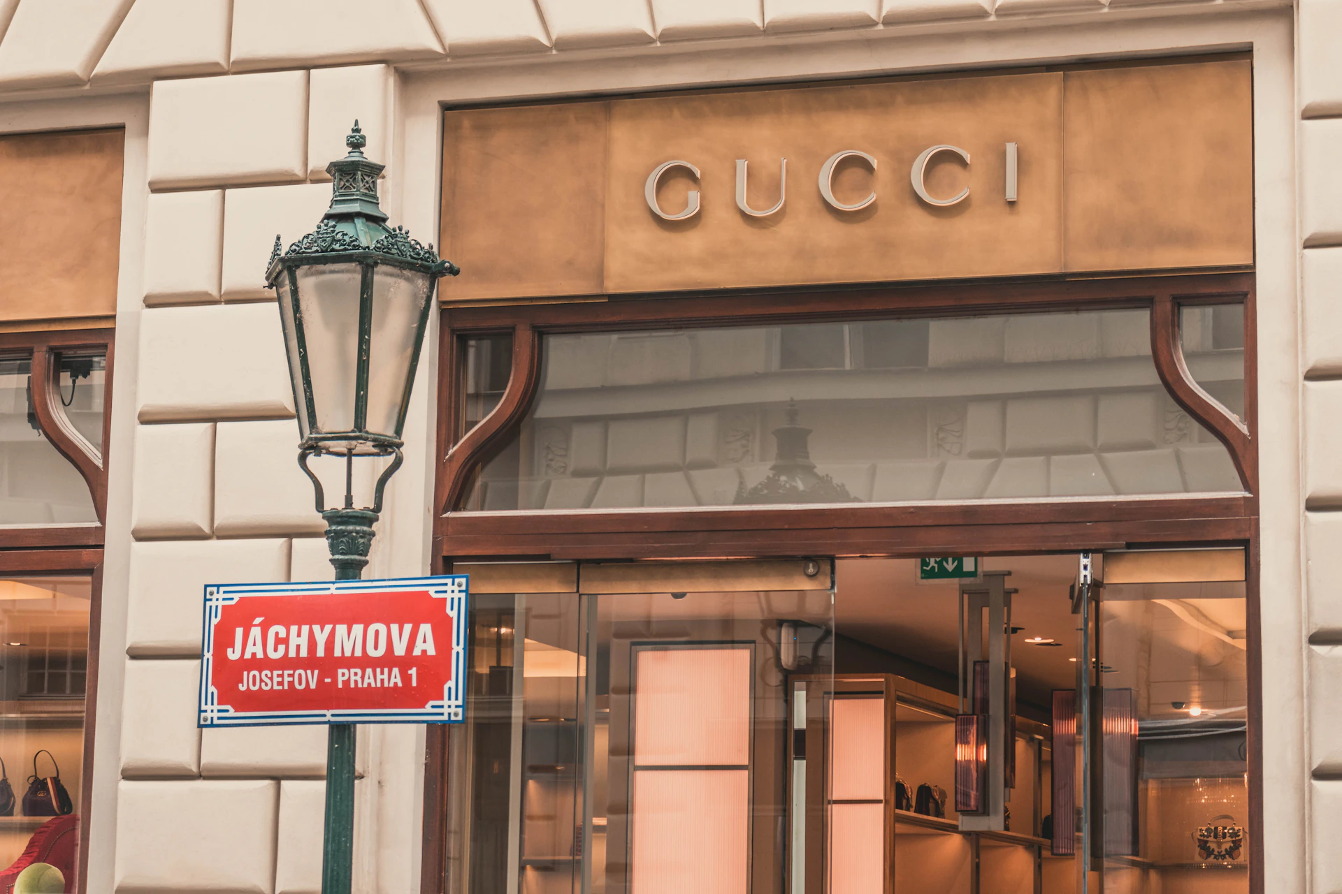 light sconce beside Gucci building signage at daytime