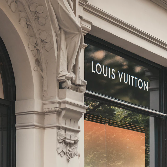 Louis Vuitton boutique signage on the facade of a city building