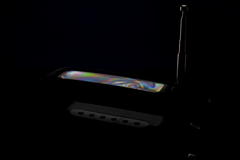 Close-up of a sleek satellite decoder with LED indicators glowing softly