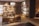 A luxurious shoe store interior with wooden walls and shelves displaying various designer shoes. There are comfortable leather chairs and a small wooden table placed in the center. The room has warm lighting and a clean, organized arrangement, creating a sophisticated atmosphere.