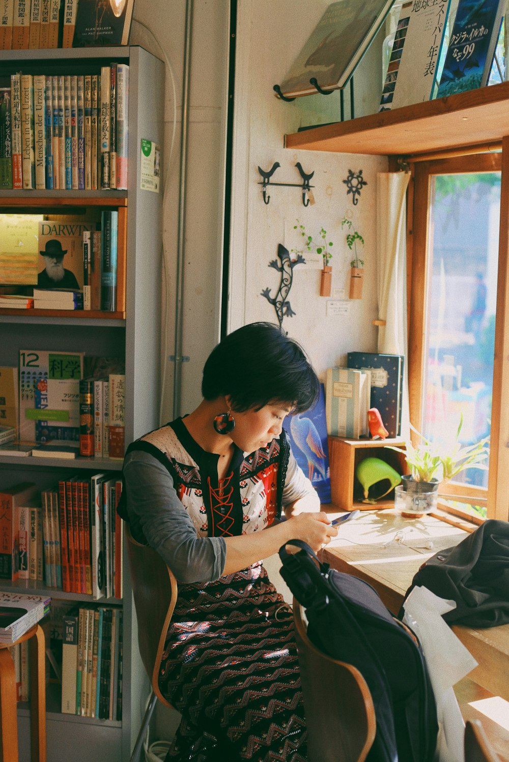 woman sitting on chair in front of table