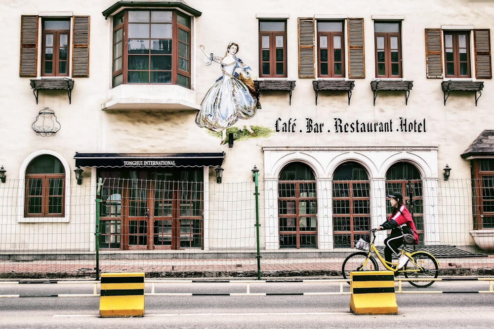 woman using yellow and black cruiser bicycle during daytime