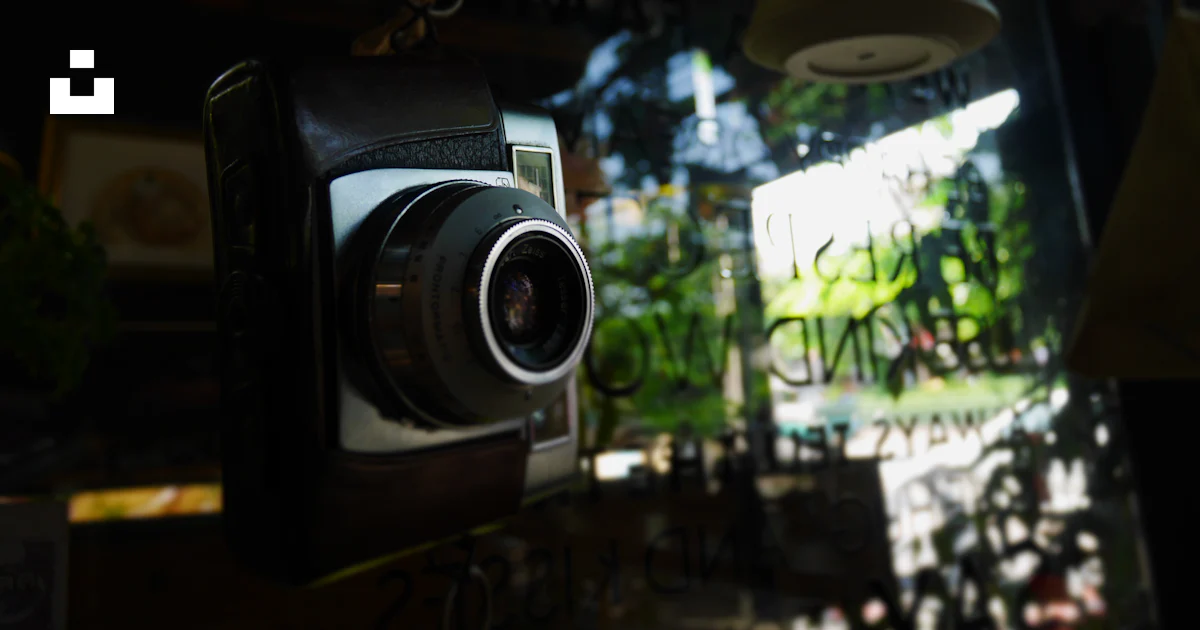 Black DSLR camera on clear glass surface photo – Free Camera Image on ...