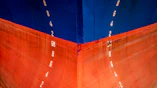 red and blue cruise ship