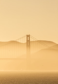 golden gate bridge covered with fog