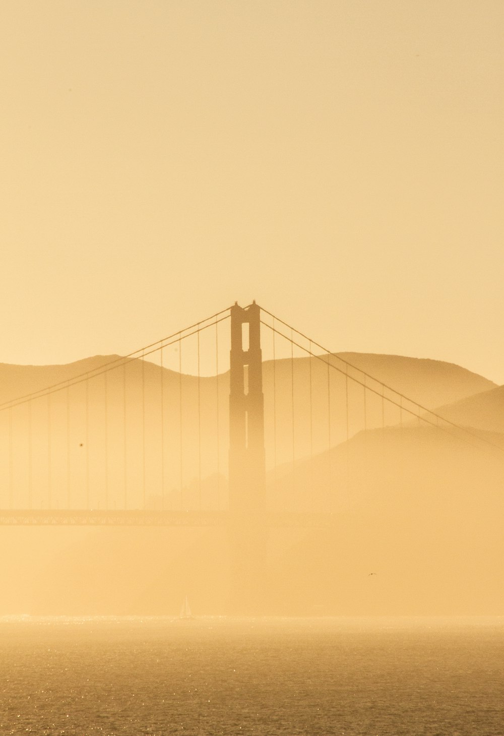 golden gate bridge covered with fog
