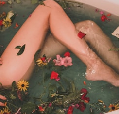 bathtub with water and flowers