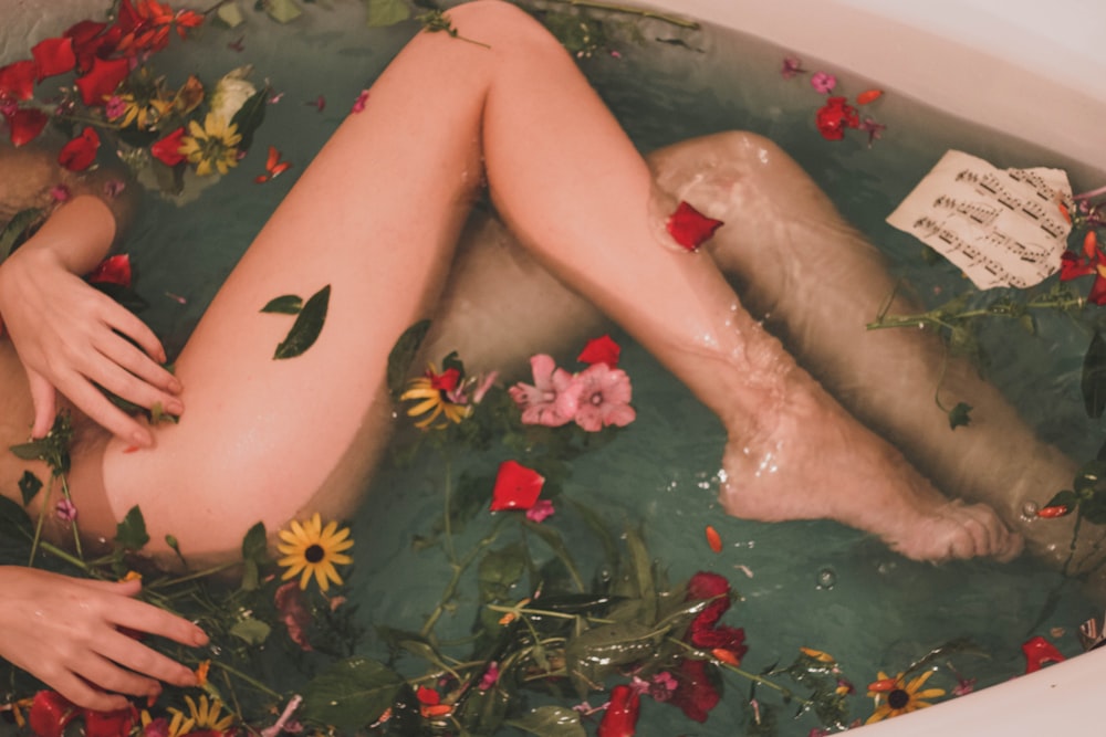 bathtub with water and flowers, CBD Molecules for skincare