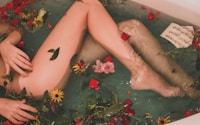 bathtub with water and flowers