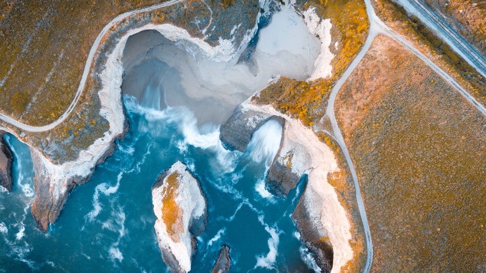 an aerial view of a body of water surrounded by land