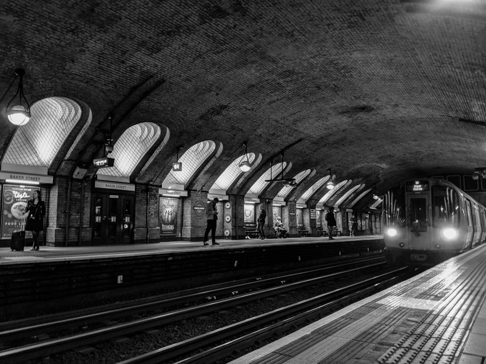 man standing on train station