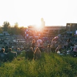 Sunset view of Rohan village with people enjoying a cultural event outdoors.
