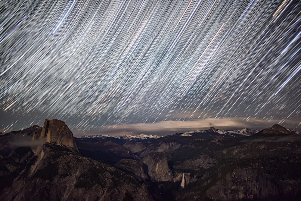the night sky is filled with star trails