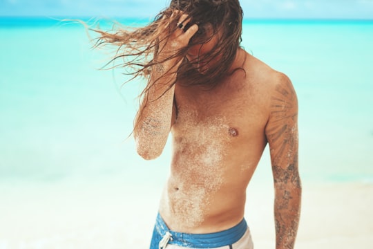 man brushing his hairs in Fulidhoo Maldives