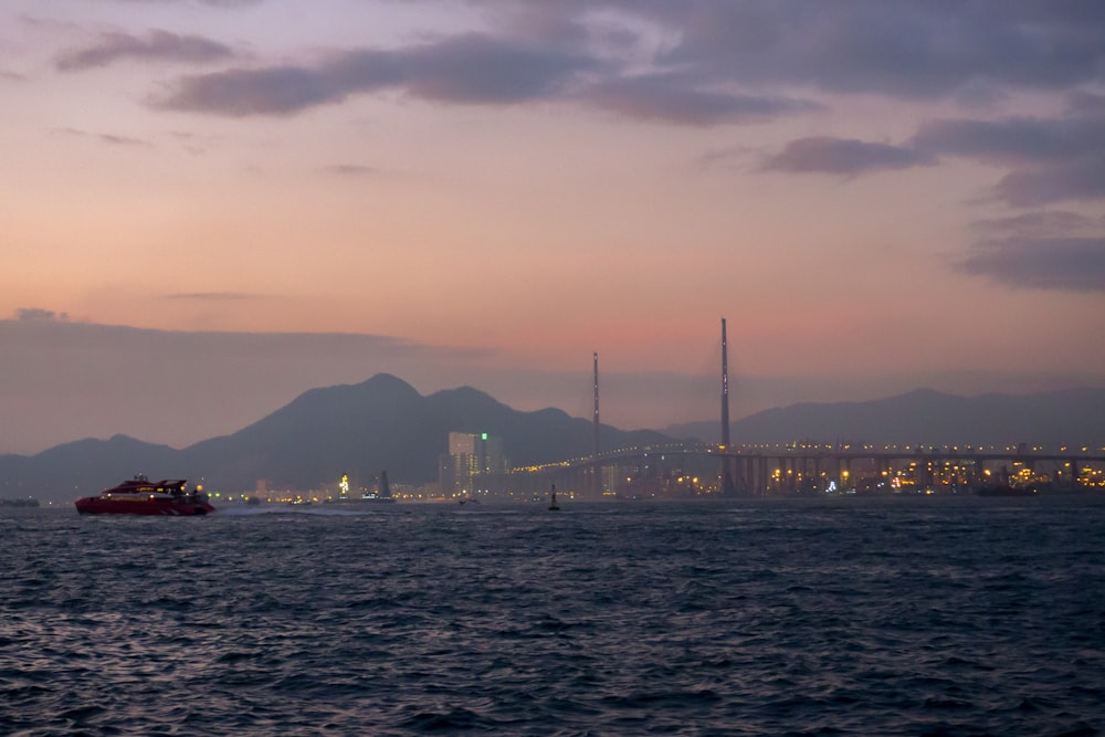 fishing boat on ocean near the city