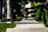 Close-up of a skateboarder’s feet on a deck, mid-trick on a city street.