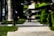 Close-up of a skateboarder’s feet on a deck, mid-trick on a city street.